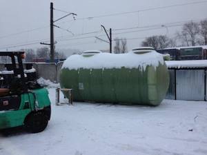 Large storage tank-septic tank in a warehouse in winter