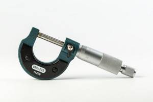What is a micrometer used for and what parts does it consist of?