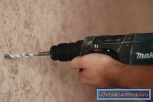 It is better to use a hammer drill to make holes in the wall.