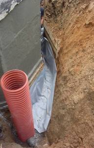 Drainage wells 315mm Uponor - are installed in the corners of the building to be drained.