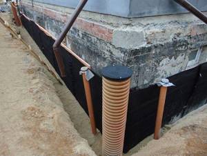 Photo - installation of a wall-mounted storm sewer system for a country house