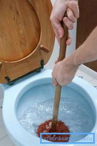 Using a plunger to remove a blockage