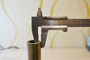 Measuring pipe wall thickness using a caliper