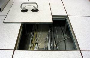 Cable system under raised floor