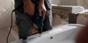 How to drill a hole in a cast iron bathtub