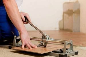 how to cut porcelain tiles at home using a manual tile cutter yourself