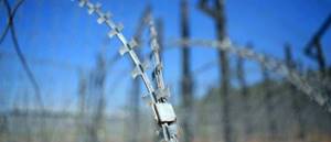 How to Attach Barbed Wire to a Metal Post