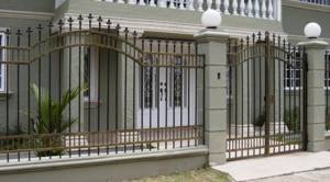 Forged gate in front of a country house