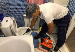 The master cleans the toilet