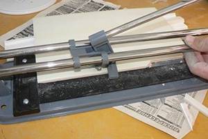 processing tiles with a manual tile cutter