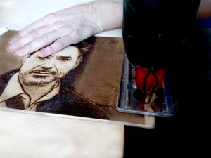 sawing off a scorched portrait