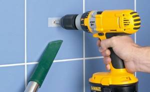 When drilling tiles with a spear drill, use a household vacuum cleaner to remove dust