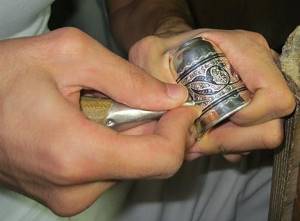 The process of applying niello to the surface of a silver product