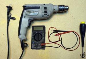Checking a drill with a multimeter