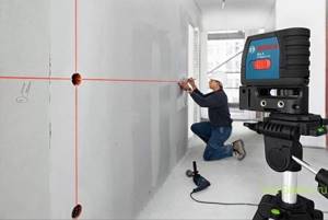 Electrician working with a level