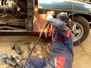 welding cars in the garage