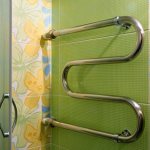 Inserting a heated towel rail into a heating or hot water riser
