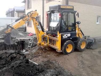 Digging a hole with an excavator
